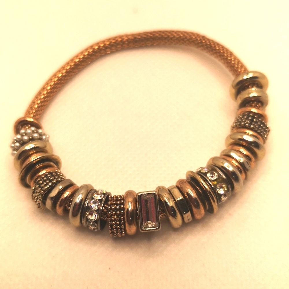 Rose gold tone stretch charm bracelet